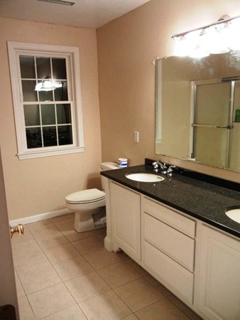 2 Fox Run Road Upton, MA 01568 - Photo 8 of 12 a bathroom with a granite countertop sink and a mirror