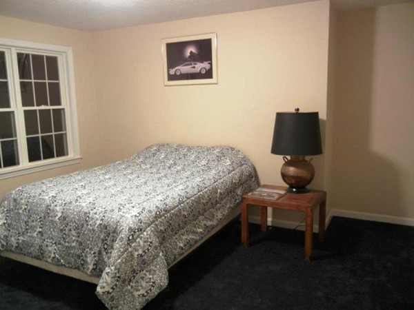 2 Fox Run Road Upton, MA 01568 - Photo 9 of 12 a bedroom with a bed and a window