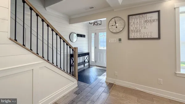 a view of hallway with wooden floor