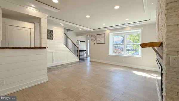a view of entryway with stairs and wooden floor
