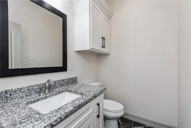 an empty room with a ceiling fan and a window