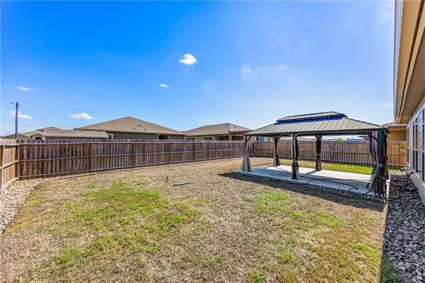 a house view with swimming pool in front of it