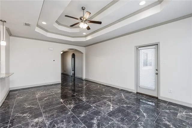 a view of a kitchen with a sink and refrigerator