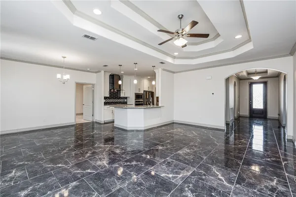 a kitchen with a sink cabinets and stainless steel appliances
