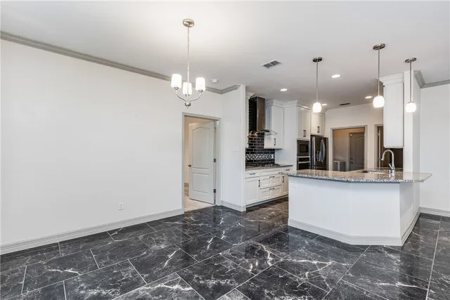 a stove top oven sitting inside of a kitchen