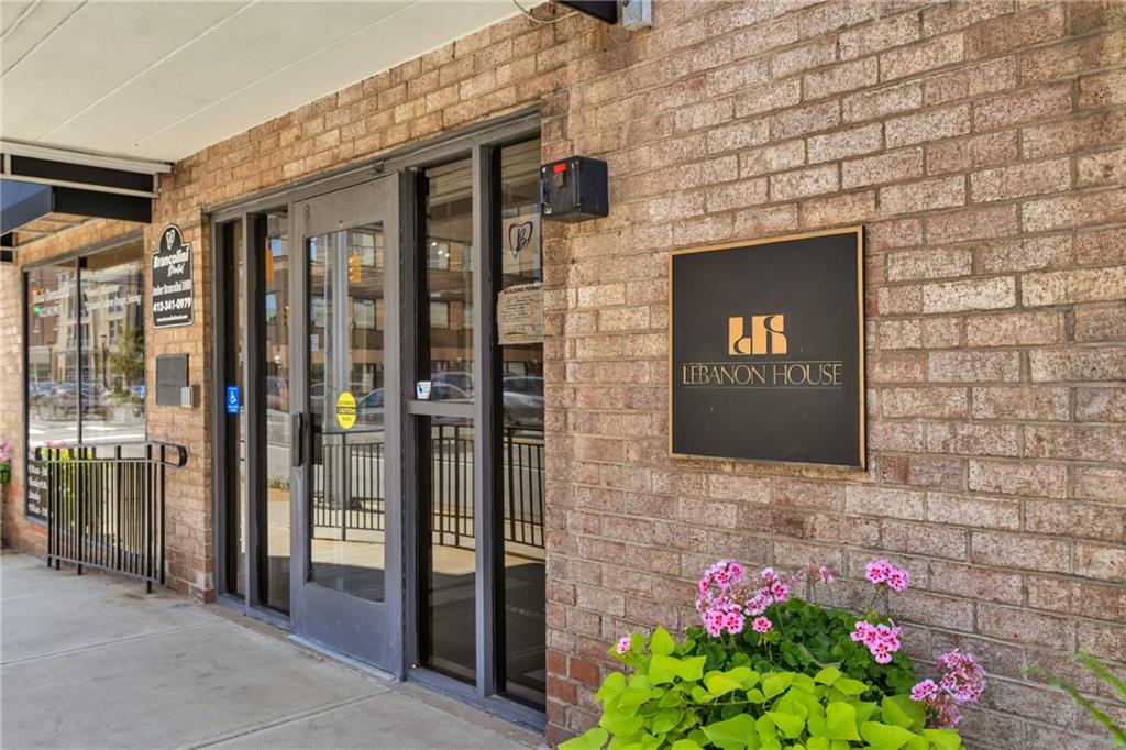 520 Washington Road, Unit 301 Pittsburgh, PA 15228 - Photo 2 of 20 a front view of a house with flower plants