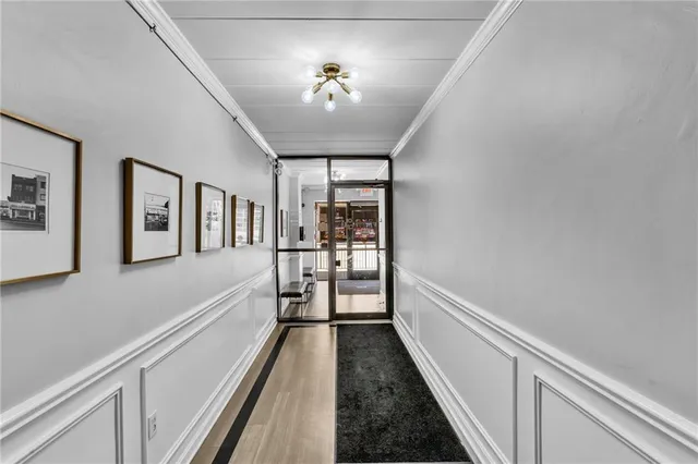 a view of a hallway with a chandelier
