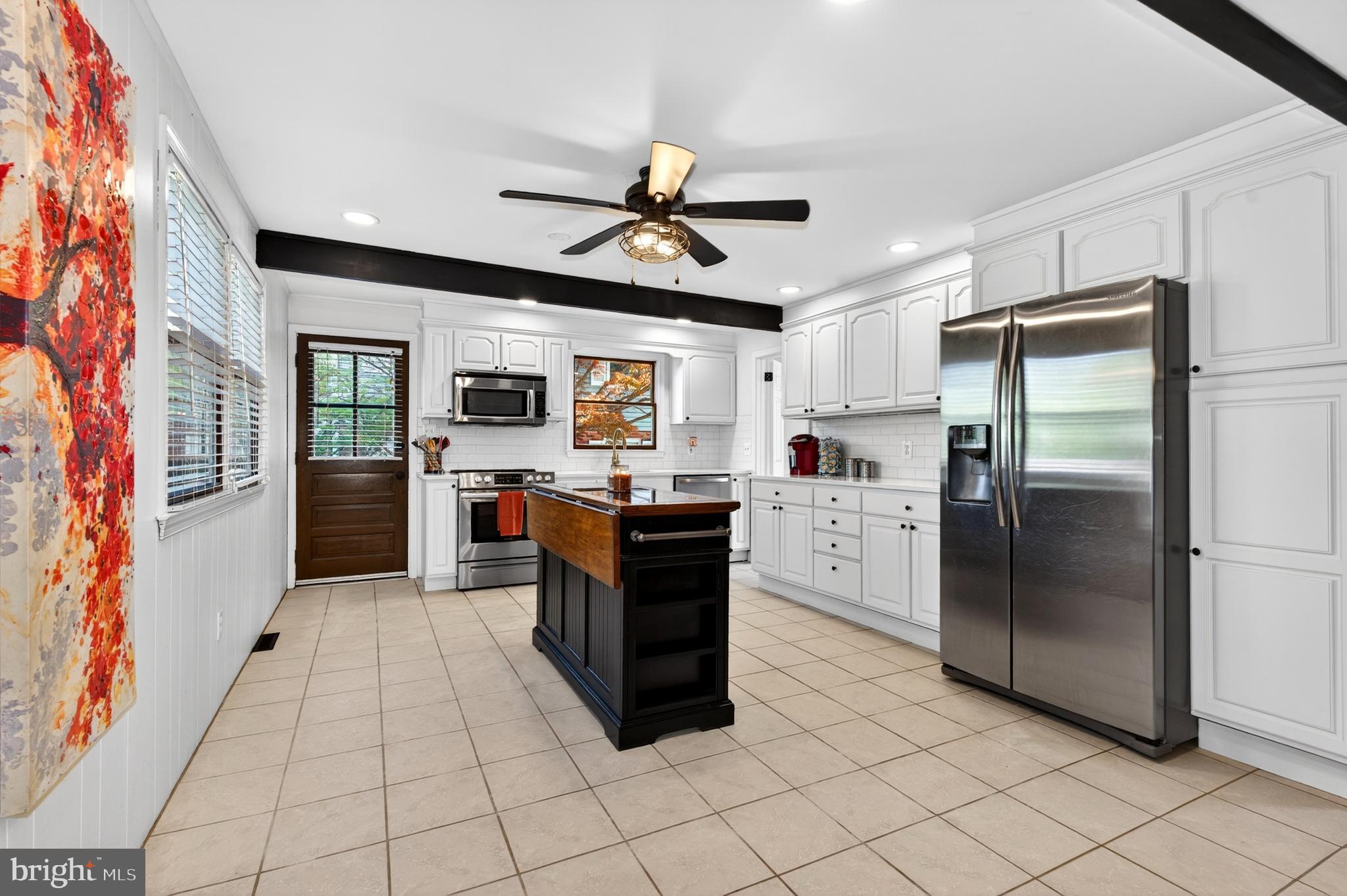 264 East Padonia Road Cockeysville, MD 21030 - Photo 16 of 53 a kitchen with stainless steel appliances granite countertop a refrigerator oven a sink and dishwasher