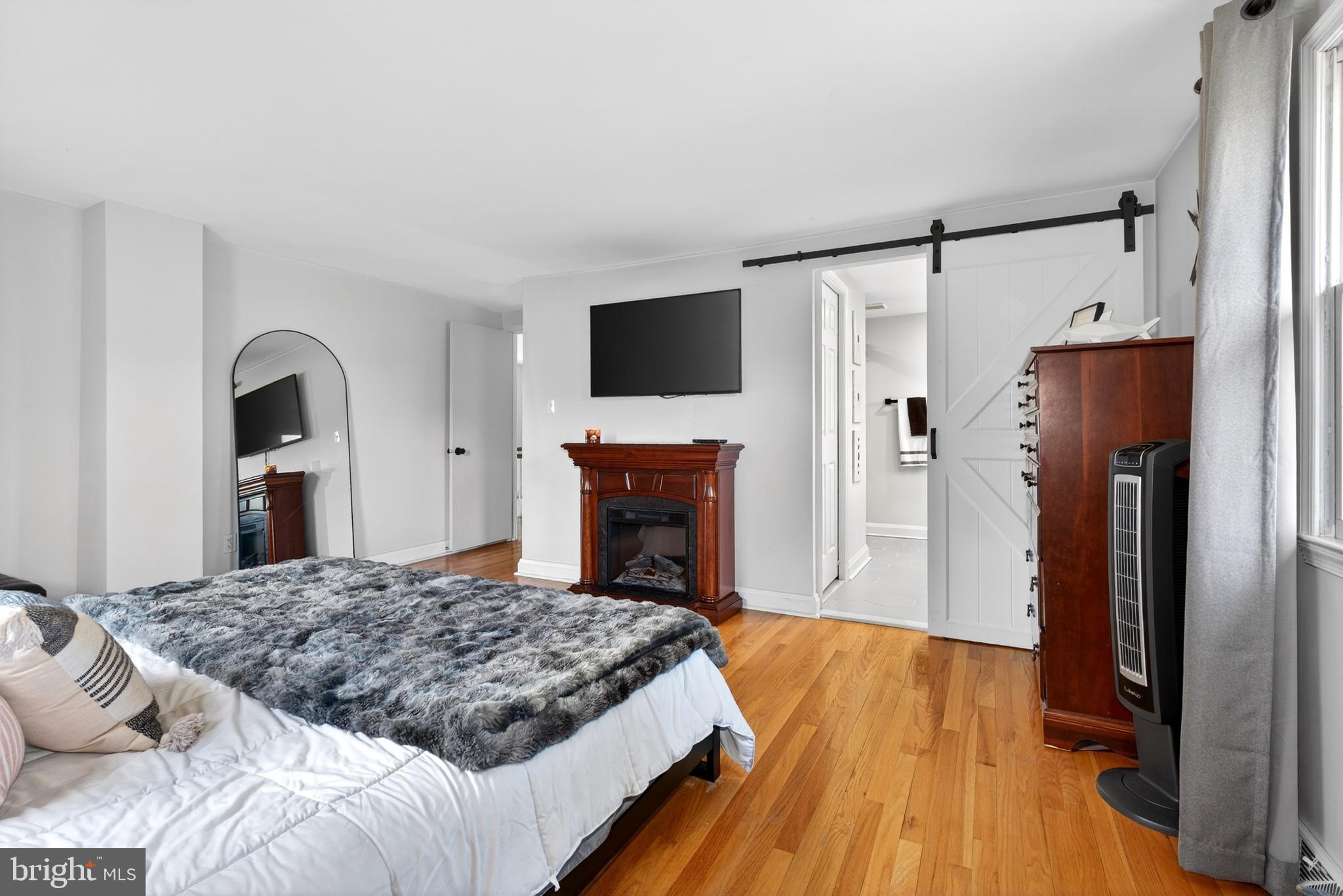 264 East Padonia Road Cockeysville, MD 21030 - Photo 32 of 53 a spacious bedroom with a bed and a flat screen tv