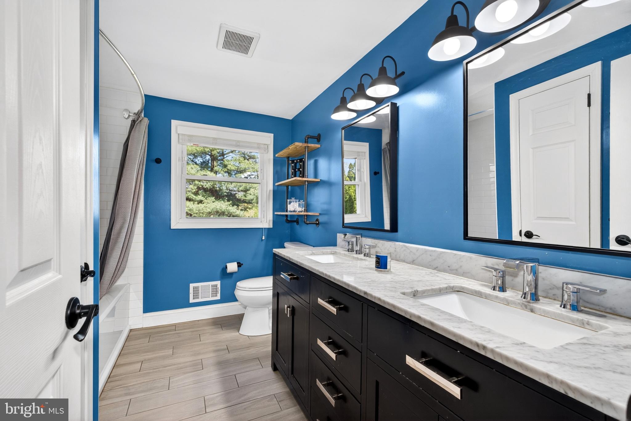 264 East Padonia Road Cockeysville, MD 21030 - Photo 35 of 53 a spacious bathroom with a granite countertop double vanity sink a large mirror and a