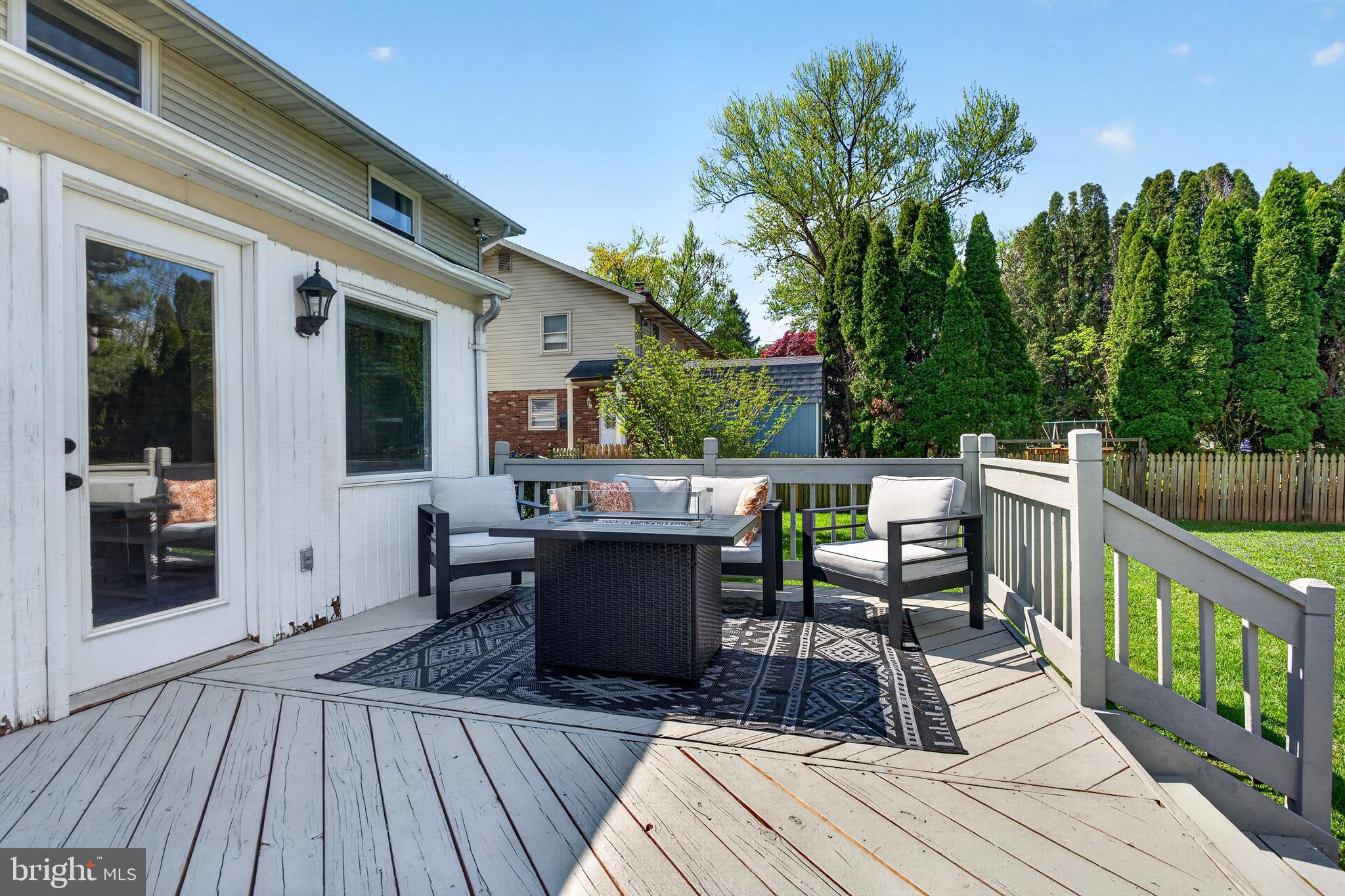 264 East Padonia Road Cockeysville, MD 21030 - Photo 43 of 53 a view of a roof deck with table and chairs a barbeque with wooden floor and fence