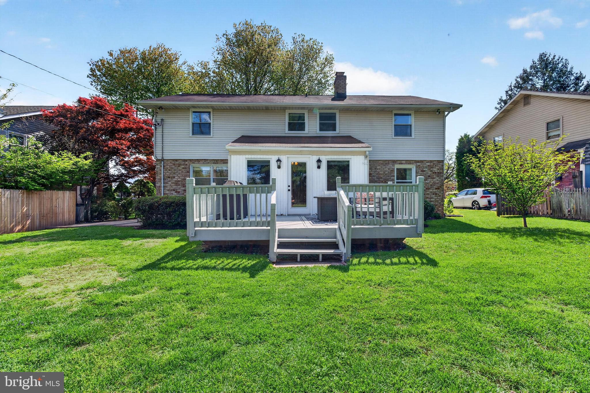 264 East Padonia Road Cockeysville, MD 21030 - Photo 47 of 53 a front view of a house with a garden and deck