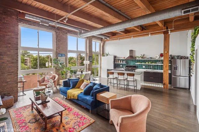a outdoor living space with patio furniture and a chandelier