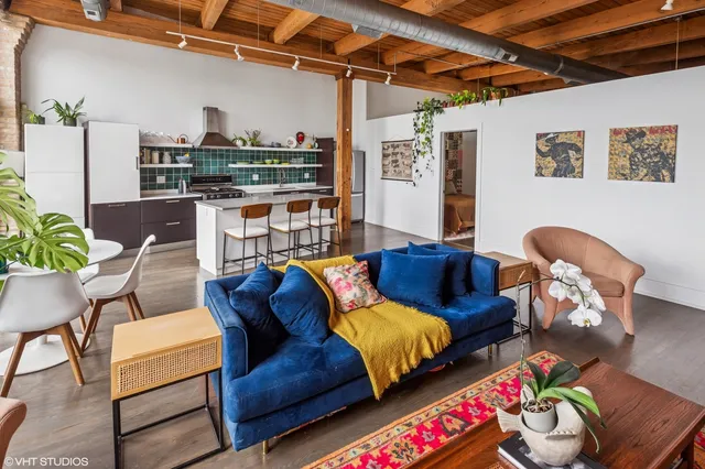 a living room with furniture and a table