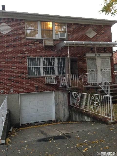 front view of a house with a street
