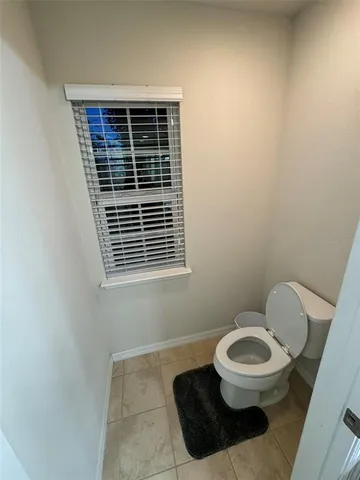 a bathroom with a tub shower and sink