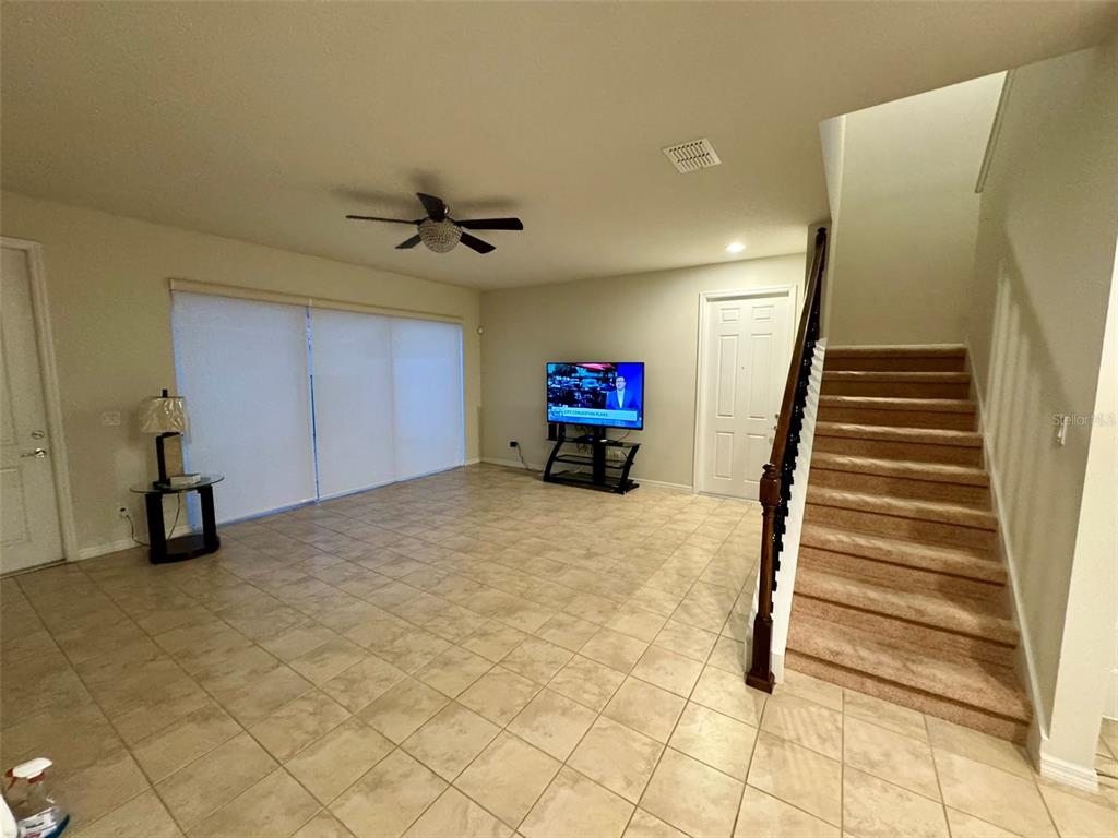 12124 Talitha Lane Orlando, FL 32827 - Photo 6 of 30 a view of a livingroom with a staircase