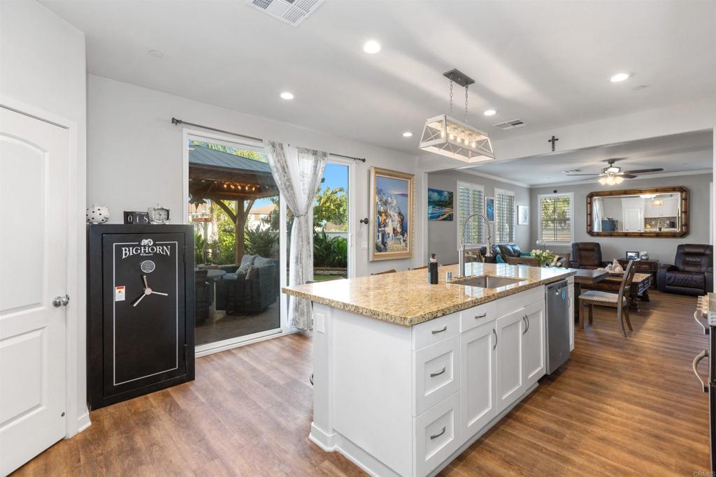 4260 C. Del Vista Oceanside, CA 92057 - Photo 14 of 38 a large white kitchen with a large window and stainless steel appliances
