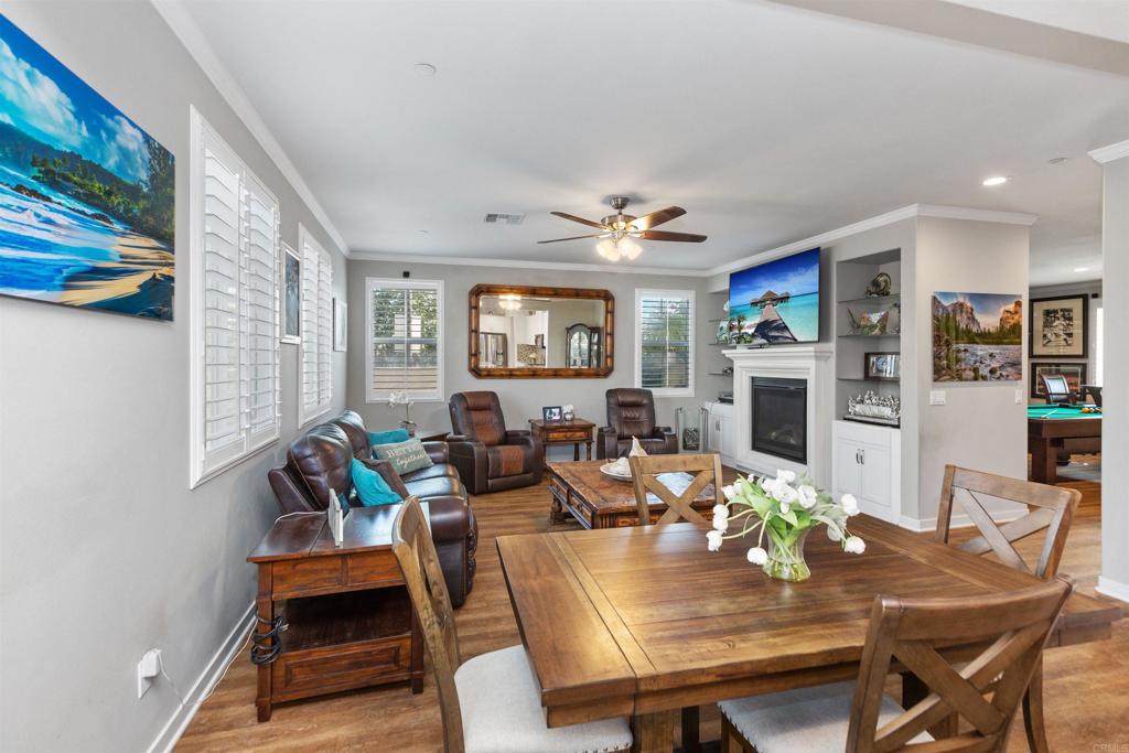 4260 C. Del Vista Oceanside, CA 92057 - Photo 17 of 38 a view of a dining room with furniture a rug and wooden floor
