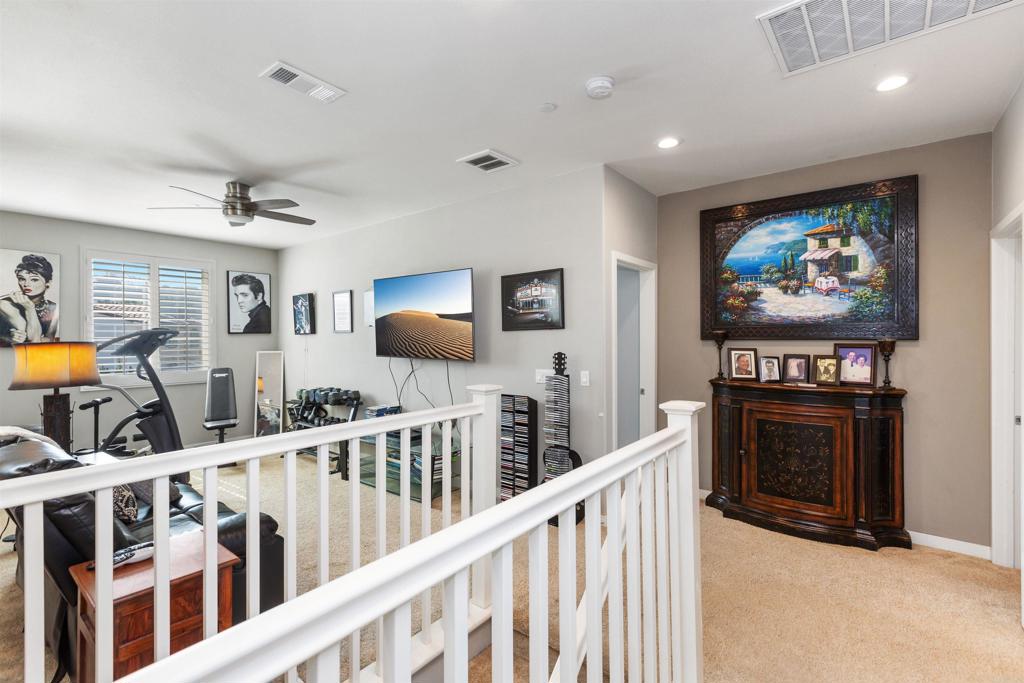 4260 C. Del Vista Oceanside, CA 92057 - Photo 19 of 38 a view of a livingroom with furniture and flat screen tv