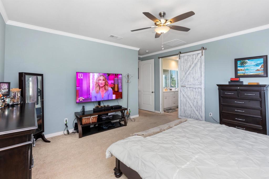 4260 C. Del Vista Oceanside, CA 92057 - Photo 21 of 38 a bedroom with a bed and a flat screen television