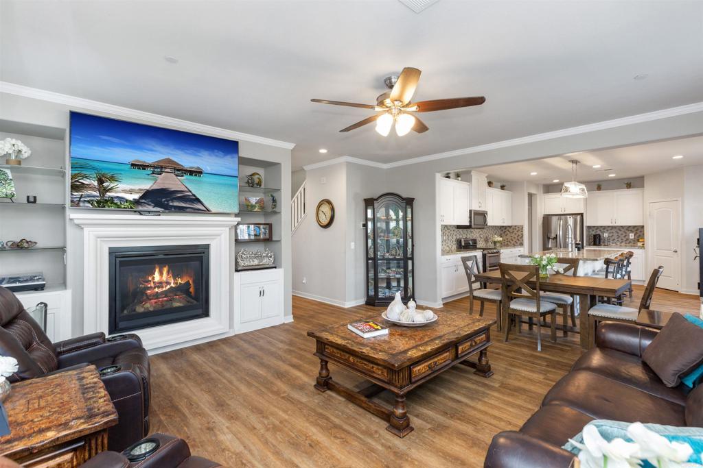 4260 C. Del Vista Oceanside, CA 92057 - Photo 9 of 38 a living room with furniture a fireplace and a flat screen tv
