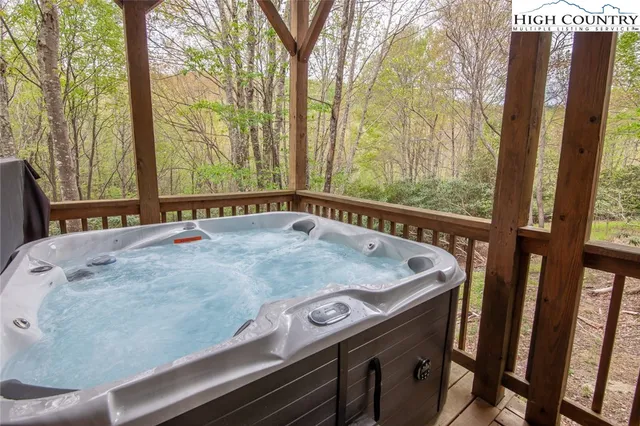 a living room with lots of furniture and a large window
