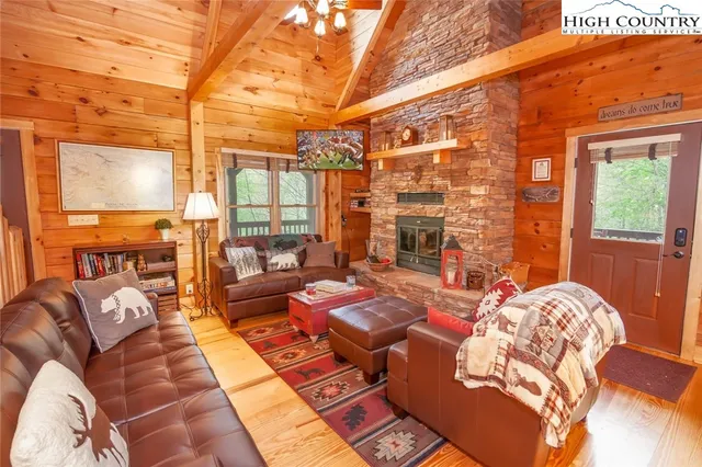 a living room with fireplace furniture and a fireplace