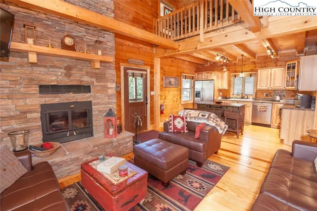 a dining hall with stainless steel appliances granite countertop a stove and a refrigerator