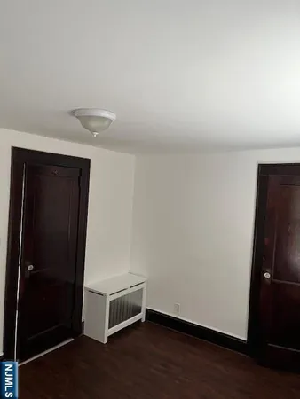 an empty room with wooden floor