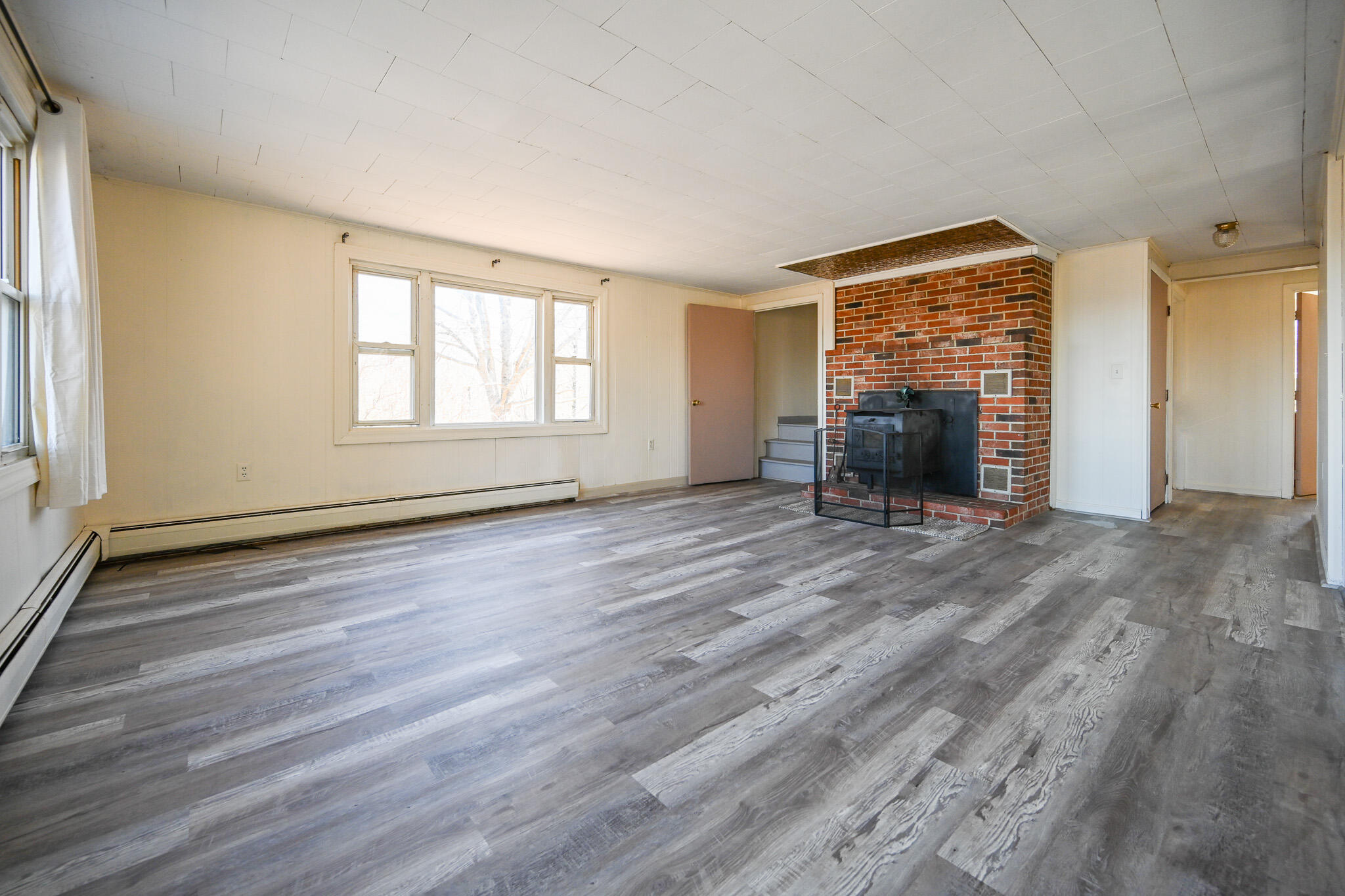 14 Hunter Drive Cornish, ME 04020 - Photo 18 of 49 Living room with woodstove