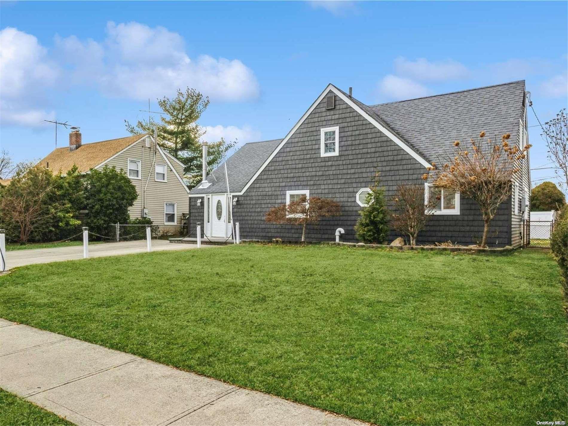 104 Hamlet Road Levittown, NY 11756 - Photo 1 of 1 a front view of a house with garden