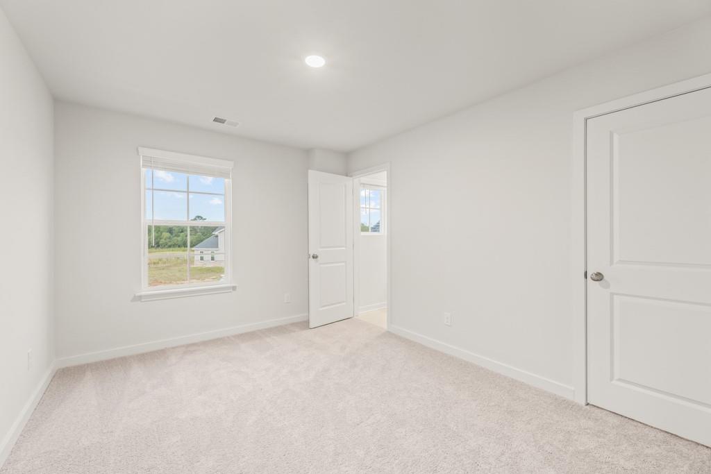 6725 Settingdown Crk Drive Dawsonville, GA 30534 - Photo 32 of 41 an empty room with windows