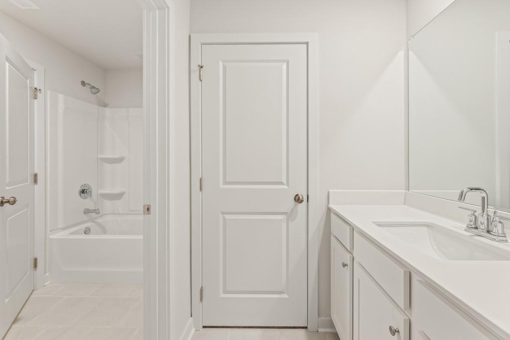 6725 Settingdown Crk Drive Dawsonville, GA 30534 - Photo 34 of 41 a bathroom with a sink and a mirror