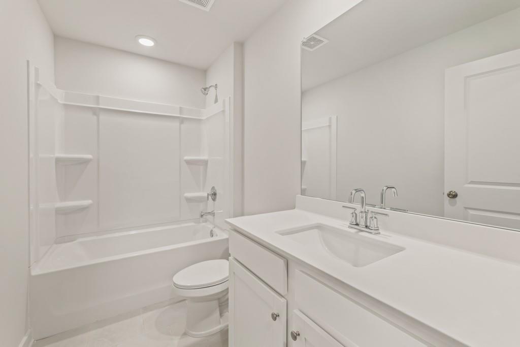 6725 Settingdown Crk Drive Dawsonville, GA 30534 - Photo 38 of 41 a bathroom with a sink a toilet and shower