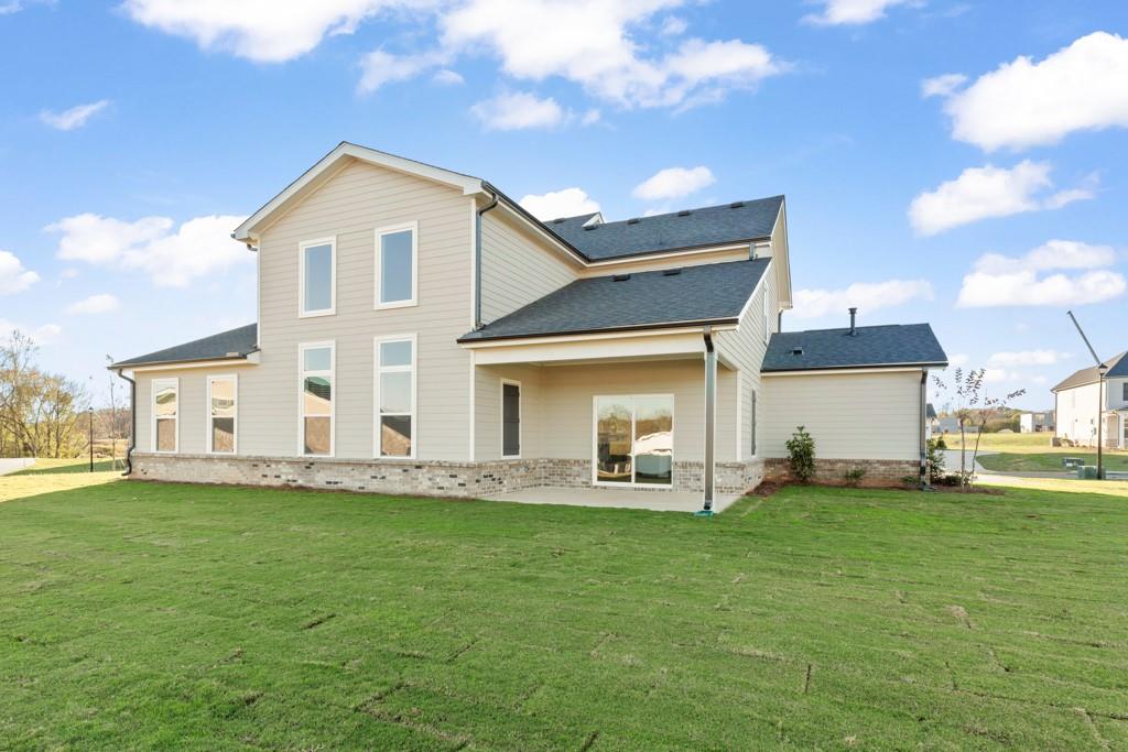 6725 Settingdown Crk Drive Dawsonville, GA 30534 - Photo 40 of 41 a view of a house with a yard and sitting area