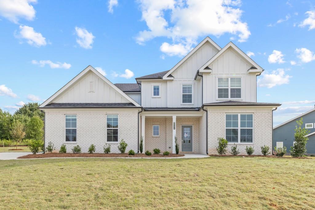 6725 Settingdown Crk Drive Dawsonville, GA 30534 - Photo 4 of 41 a front view of a house with a yard