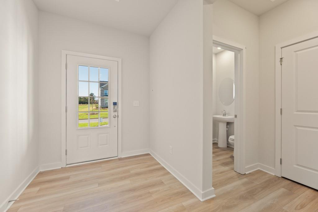 6725 Settingdown Crk Drive Dawsonville, GA 30534 - Photo 6 of 41 wooden floor in a hall with an entryway and a room