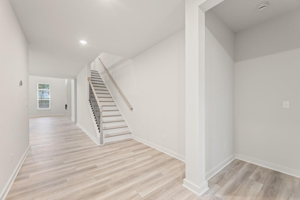 6725 Settingdown Crk Drive Dawsonville, GA 30534 - Photo 8 of 41 a view of a hallway with wooden floor