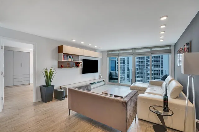 a view of a tall building next to a road