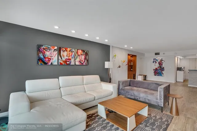 a kitchen with granite countertop a refrigerator stove and sink