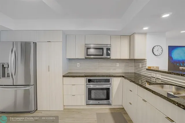 a bedroom with furniture and a flat screen tv