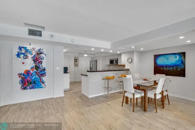 a kitchen with a sink and a large window
