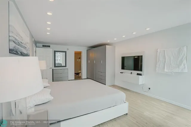 a kitchen that has a washer and dryer in it