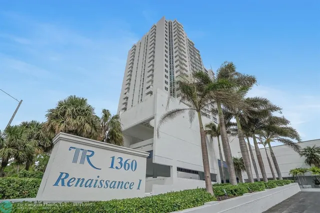 a large kitchen with a table and chairs