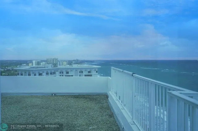 a view of a swimming pool with a lounge chairs
