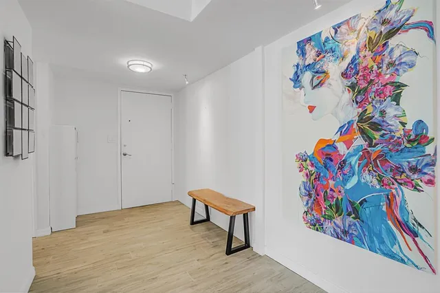 a kitchen with granite countertop a refrigerator stove and sink