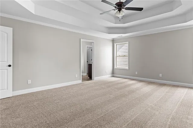 a view of a livingroom with a ceiling fan and window