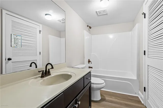 a bathroom with a sink a toilet and a bathtub