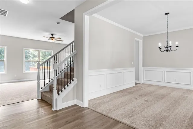 a view of an entryway with wooden floor